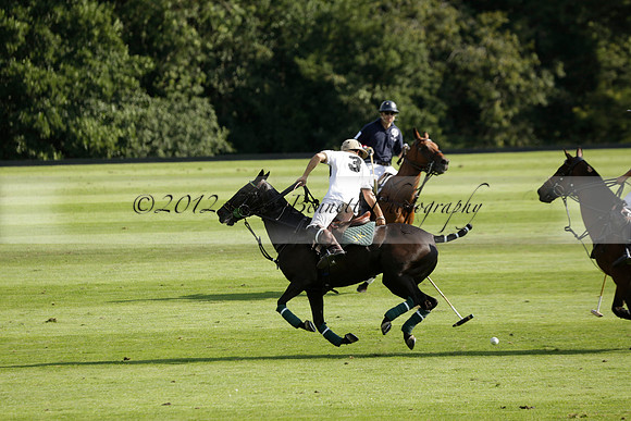 Pandas (white) v Home Farm (navy) in a Park House West Sussex Cup Polo match on Brooksfield at Cowdray Park Polo Club on Friday 30 August 2013. 2013.08.30 www.polopictures.co.uk