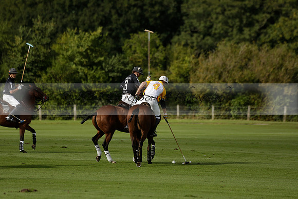 Aryana (black) v Shoreline (yellow) in a Farewell Cup polo match played on Ambersham 5 at Cowdray Park Polo Club on Wednesday 18 September 2013. www.polopictures.co.uk