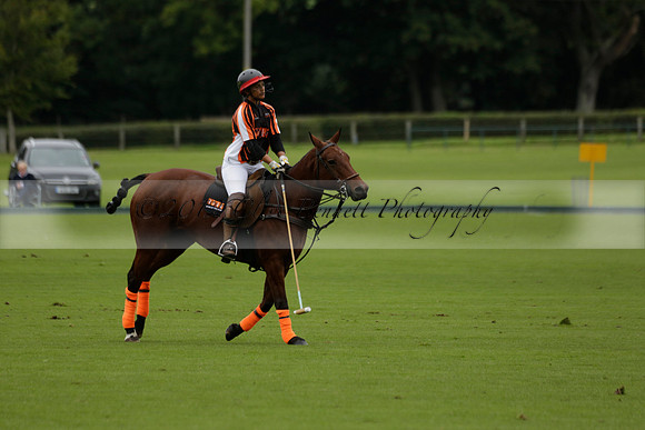 Four Quarters Black (black) v Clashleigh (red) in the Autumn Cup subsidiary final polo match on Ambersham 2 at Cowdray Park Polo Club on Sunday 22 September 2013 www.polopictures.co.uk