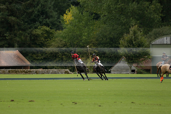 Four Quarters Black (black) v Clashleigh (red) in the Autumn Cup subsidiary final polo match on Ambersham 2 at Cowdray Park Polo Club on Sunday 22 September 2013 www.polopictures.co.uk