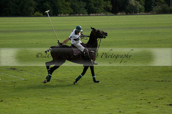 Pandas (white) v Home Farm (navy) in a Park House West Sussex Cup Polo match on Brooksfield at Cowdray Park Polo Club on Friday 30 August 2013. 2013.08.30 www.polopictures.co.uk