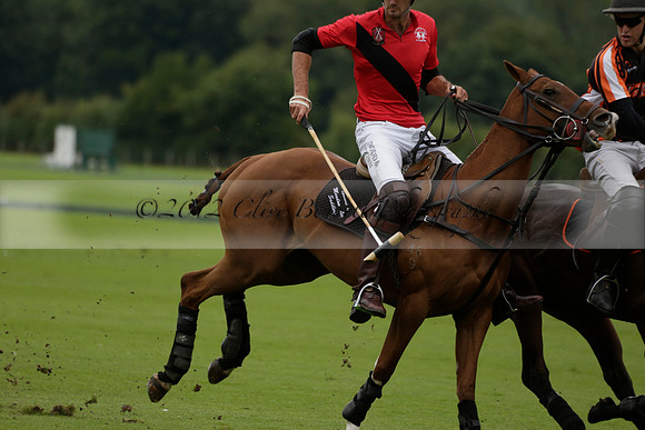 Four Quarters Black (black) v Clashleigh (red) in the Autumn Cup subsidiary final polo match on Ambersham 2 at Cowdray Park Polo Club on Sunday 22 September 2013 www.polopictures.co.uk