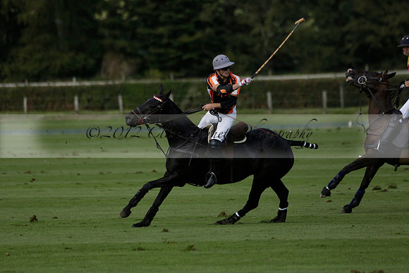 Four Quarters Black (black) v BHC (red) in a Autumn Cup polo match on Ambersham 2 at Cowdray Park Polo Club on Friday 20 September 2013 www.polopictures.co.uk