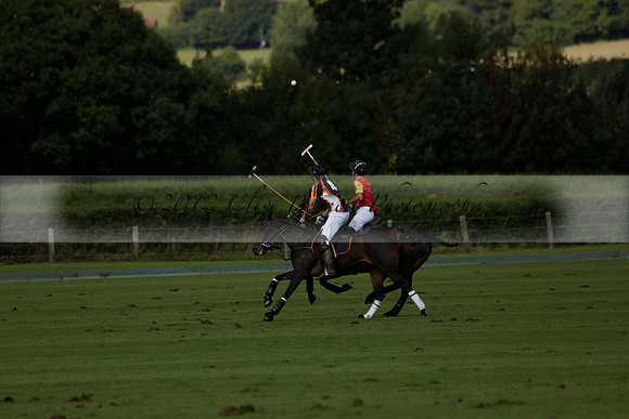 Four Quarters Black (black) v BHC (red) in a Autumn Cup polo match on Ambersham 2 at Cowdray Park Polo Club on Friday 20 September 2013 www.polopictures.co.uk