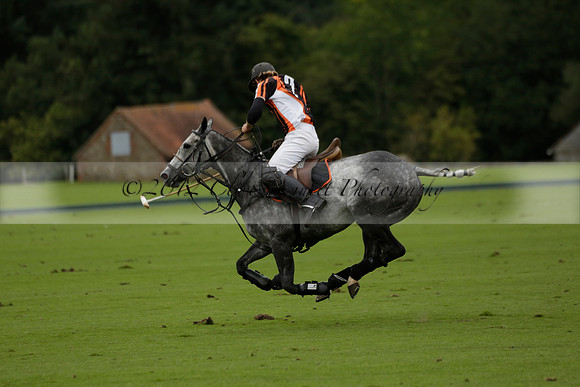 Four Quarters Black (black) v Clashleigh (red) in the Autumn Cup subsidiary final polo match on Ambersham 2 at Cowdray Park Polo Club on Sunday 22 September 2013 www.polopictures.co.uk