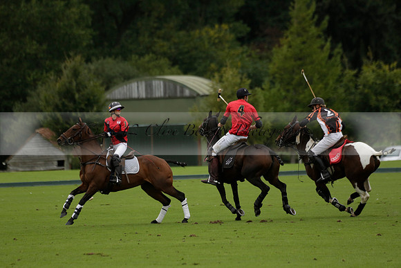 Four Quarters Black (black) v Clashleigh (red) in the Autumn Cup subsidiary final polo match on Ambersham 2 at Cowdray Park Polo Club on Sunday 22 September 2013 www.polopictures.co.uk