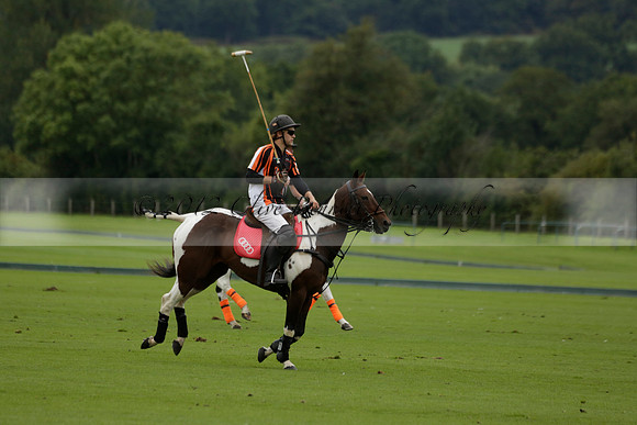 Four Quarters Black (black) v Clashleigh (red) in the Autumn Cup subsidiary final polo match on Ambersham 2 at Cowdray Park Polo Club on Sunday 22 September 2013 www.polopictures.co.uk