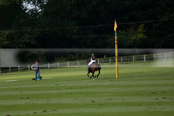 Four Quarters Black (black) v BHC (red) in a Autumn Cup polo match on Ambersham 2 at Cowdray Park Polo Club on Friday 20 September 2013 www.polopictures.co.uk