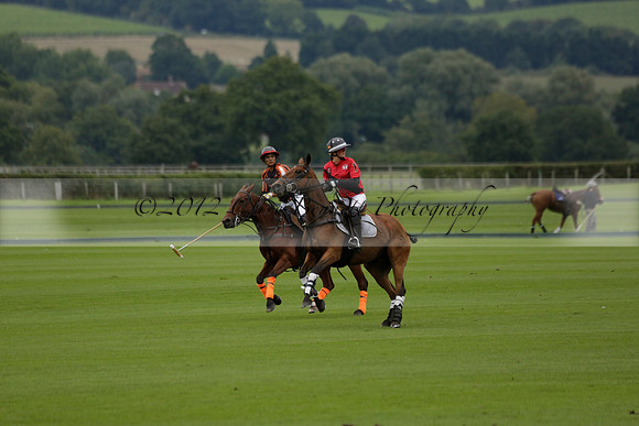 Four Quarters Black (black) v Clashleigh (red) in the Autumn Cup subsidiary final polo match on Ambersham 2 at Cowdray Park Polo Club on Sunday 22 September 2013 www.polopictures.co.uk