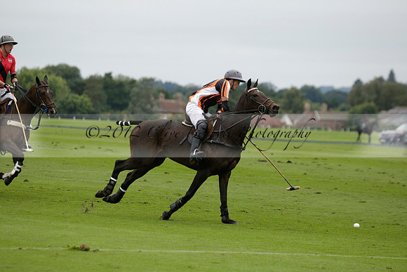 Four Quarters Black (black) v Clashleigh (red) in the Autumn Cup subsidiary final polo match on Ambersham 2 at Cowdray Park Polo Club on Sunday 22 September 2013 www.polopictures.co.uk