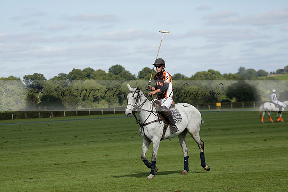 Four Quarters Black (black) v BHC (red) in a Autumn Cup polo match on Ambersham 2 at Cowdray Park Polo Club on Friday 20 September 2013 www.polopictures.co.uk