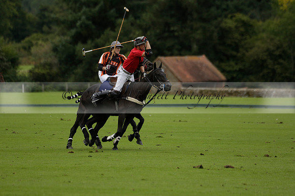Four Quarters Black (black) v Clashleigh (red) in the Autumn Cup subsidiary final polo match on Ambersham 2 at Cowdray Park Polo Club on Sunday 22 September 2013 www.polopictures.co.uk