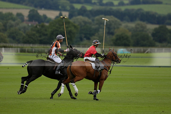 Four Quarters Black (black) v Clashleigh (red) in the Autumn Cup subsidiary final polo match on Ambersham 2 at Cowdray Park Polo Club on Sunday 22 September 2013 www.polopictures.co.uk