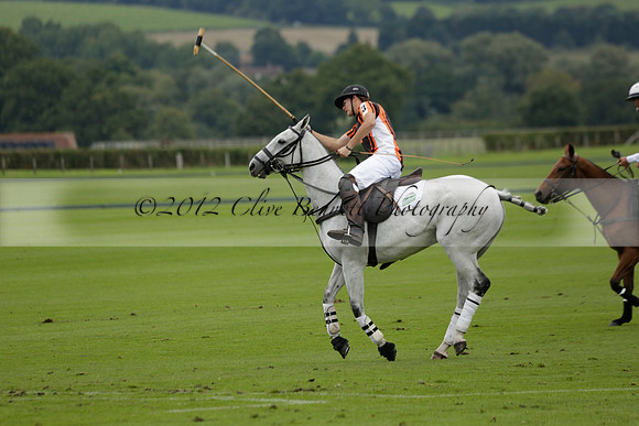 Four Quarters Black (black) v Clashleigh (red) in the Autumn Cup subsidiary final polo match on Ambersham 2 at Cowdray Park Polo Club on Sunday 22 September 2013 www.polopictures.co.uk