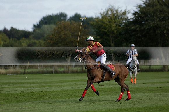 Four Quarters Black (black) v BHC (red) in a Autumn Cup polo match on Ambersham 2 at Cowdray Park Polo Club on Friday 20 September 2013 www.polopictures.co.uk