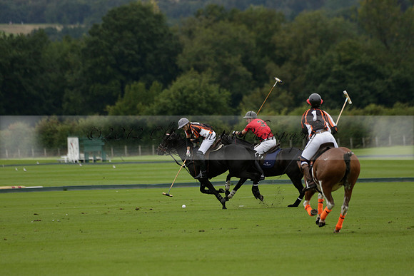 Four Quarters Black (black) v Clashleigh (red) in the Autumn Cup subsidiary final polo match on Ambersham 2 at Cowdray Park Polo Club on Sunday 22 September 2013 www.polopictures.co.uk