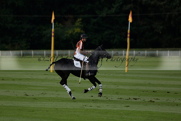 Four Quarters Black (black) v BHC (red) in a Autumn Cup polo match on Ambersham 2 at Cowdray Park Polo Club on Friday 20 September 2013 www.polopictures.co.uk