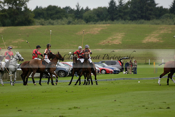Four Quarters Black (black) v Clashleigh (red) in the Autumn Cup subsidiary final polo match on Ambersham 2 at Cowdray Park Polo Club on Sunday 22 September 2013 www.polopictures.co.uk