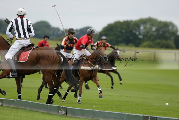 Four Quarters Black (black) v Clashleigh (red) in the Autumn Cup subsidiary final polo match on Ambersham 2 at Cowdray Park Polo Club on Sunday 22 September 2013 www.polopictures.co.uk