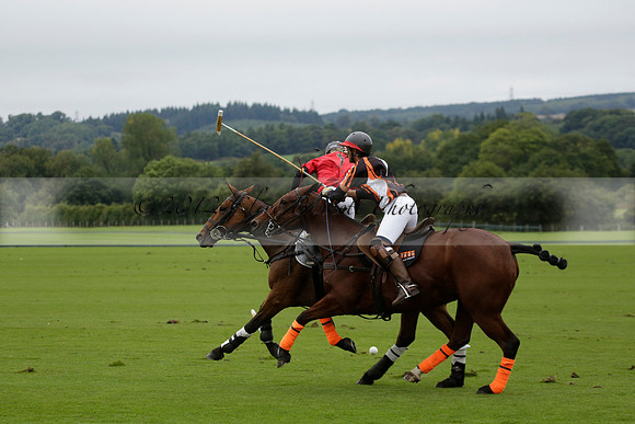 Four Quarters Black (black) v Clashleigh (red) in the Autumn Cup subsidiary final polo match on Ambersham 2 at Cowdray Park Polo Club on Sunday 22 September 2013 www.polopictures.co.uk