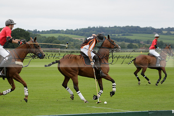 Four Quarters Black (black) v Clashleigh (red) in the Autumn Cup subsidiary final polo match on Ambersham 2 at Cowdray Park Polo Club on Sunday 22 September 2013 www.polopictures.co.uk