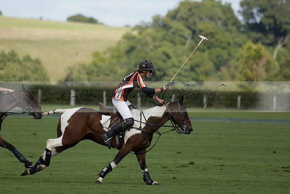 Four Quarters Black (black) v BHC (red) in a Autumn Cup polo match on Ambersham 2 at Cowdray Park Polo Club on Friday 20 September 2013 www.polopictures.co.uk
