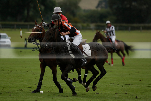 Four Quarters Black (black) v Clashleigh (red)in a Jaeger Le Coultre Autumn Cup polo match played on Ambersham 2 at Cowdray Park Polo Club on Wednesday 2013.09.11 www.polopictures.co.uk