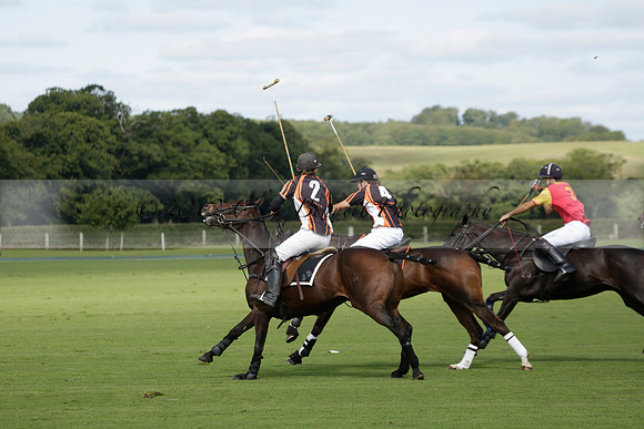 Four Quarters Black (black) v BHC (red) in a Autumn Cup polo match on Ambersham 2 at Cowdray Park Polo Club on Friday 20 September 2013 www.polopictures.co.uk