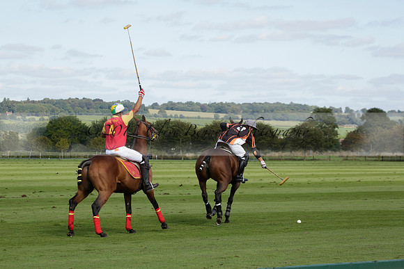 Four Quarters Black (black) v BHC (red) in a Autumn Cup polo match on Ambersham 2 at Cowdray Park Polo Club on Friday 20 September 2013 www.polopictures.co.uk