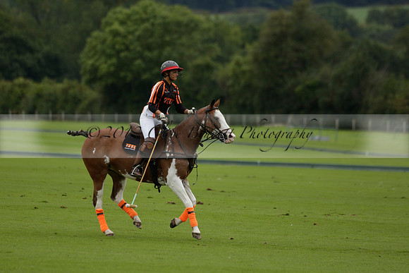 Four Quarters Black (black) v Clashleigh (red) in the Autumn Cup subsidiary final polo match on Ambersham 2 at Cowdray Park Polo Club on Sunday 22 September 2013 www.polopictures.co.uk