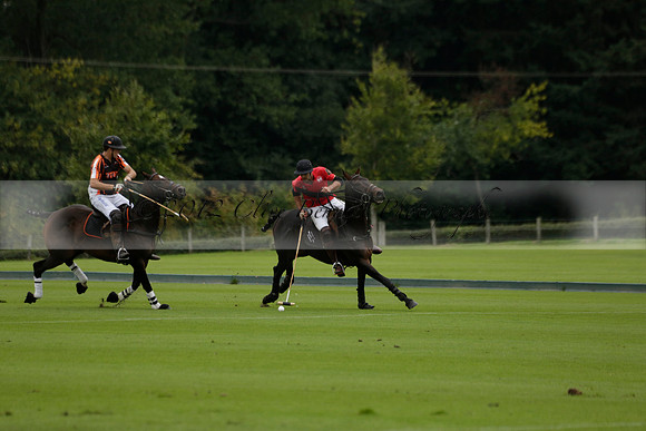 Four Quarters Black (black) v Clashleigh (red) in the Autumn Cup subsidiary final polo match on Ambersham 2 at Cowdray Park Polo Club on Sunday 22 September 2013 www.polopictures.co.uk