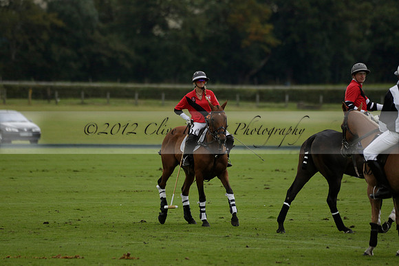 Four Quarters Black (black) v Clashleigh (red)in a Jaeger Le Coultre Autumn Cup polo match played on Ambersham 2 at Cowdray Park Polo Club on Wednesday 2013.09.11 www.polopictures.co.uk