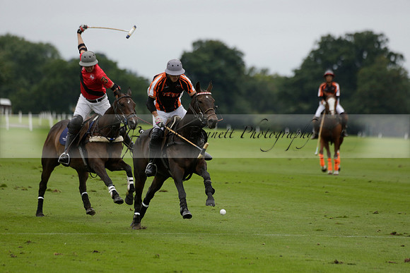 Four Quarters Black (black) v Clashleigh (red) in the Autumn Cup subsidiary final polo match on Ambersham 2 at Cowdray Park Polo Club on Sunday 22 September 2013 www.polopictures.co.uk