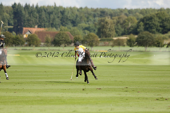Aryana (black) v Shoreline (yellow) in a Farewell Cup polo match played on Ambersham 5 at Cowdray Park Polo Club on Wednesday 18 September 2013. www.polopictures.co.uk