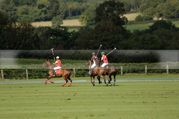 Four Quarters Black (black) v BHC (red) in a Autumn Cup polo match on Ambersham 2 at Cowdray Park Polo Club on Friday 20 September 2013 www.polopictures.co.uk