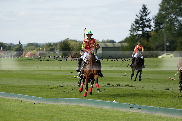 Four Quarters Black (black) v BHC (red) in a Autumn Cup polo match on Ambersham 2 at Cowdray Park Polo Club on Friday 20 September 2013 www.polopictures.co.uk