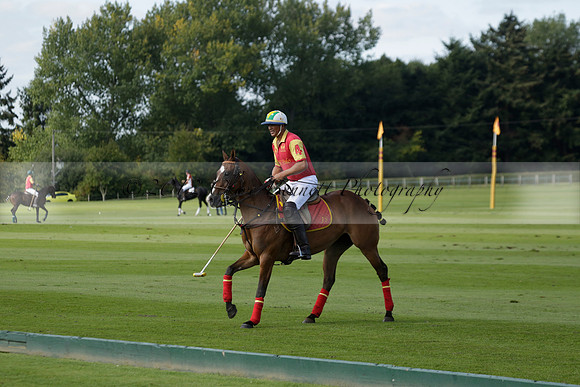 Four Quarters Black (black) v BHC (red) in a Autumn Cup polo match on Ambersham 2 at Cowdray Park Polo Club on Friday 20 September 2013 www.polopictures.co.uk
