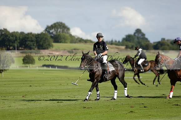 Aryana (black) v Shoreline (yellow) in a Farewell Cup polo match played on Ambersham 5 at Cowdray Park Polo Club on Wednesday 18 September 2013. www.polopictures.co.uk