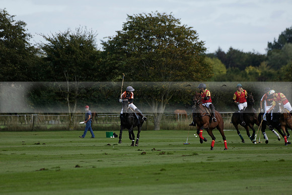 Four Quarters Black (black) v BHC (red) in a Autumn Cup polo match on Ambersham 2 at Cowdray Park Polo Club on Friday 20 September 2013 www.polopictures.co.uk