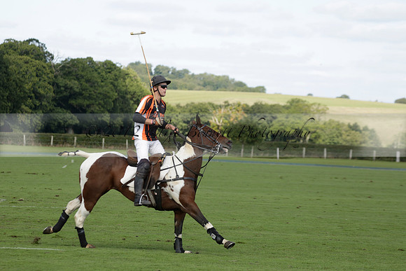 Four Quarters Black (black) v BHC (red) in a Autumn Cup polo match on Ambersham 2 at Cowdray Park Polo Club on Friday 20 September 2013 www.polopictures.co.uk