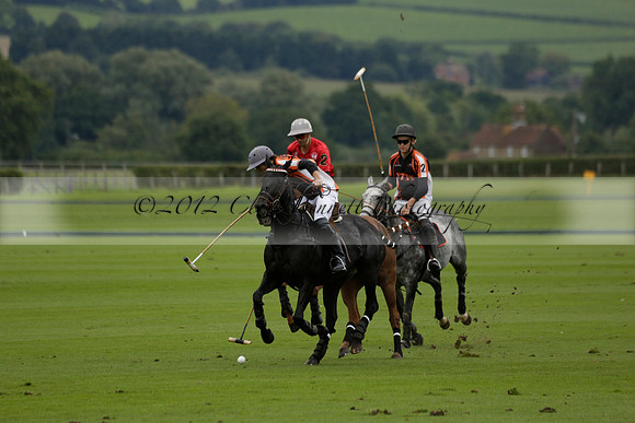 Four Quarters Black (black) v Clashleigh (red) in the Autumn Cup subsidiary final polo match on Ambersham 2 at Cowdray Park Polo Club on Sunday 22 September 2013 www.polopictures.co.uk