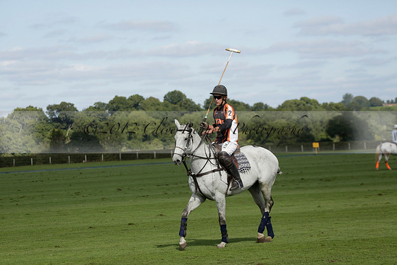 Four Quarters Black (black) v BHC (red) in a Autumn Cup polo match on Ambersham 2 at Cowdray Park Polo Club on Friday 20 September 2013 www.polopictures.co.uk
