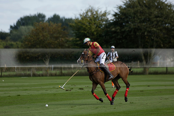 Four Quarters Black (black) v BHC (red) in a Autumn Cup polo match on Ambersham 2 at Cowdray Park Polo Club on Friday 20 September 2013 www.polopictures.co.uk
