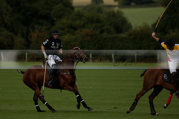 Aryana (black) v Shoreline (yellow) in a Farewell Cup polo match played on Ambersham 5 at Cowdray Park Polo Club on Wednesday 18 September 2013. www.polopictures.co.uk