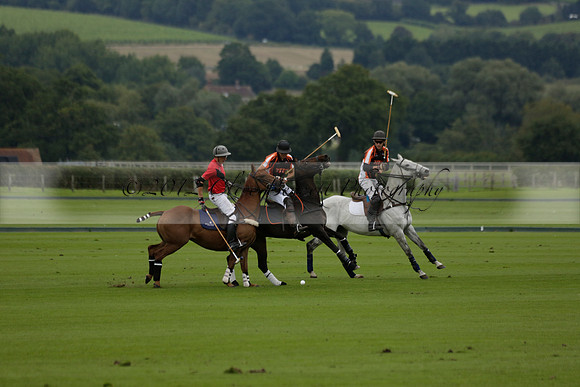Four Quarters Black (black) v Clashleigh (red) in the Autumn Cup subsidiary final polo match on Ambersham 2 at Cowdray Park Polo Club on Sunday 22 September 2013 www.polopictures.co.uk