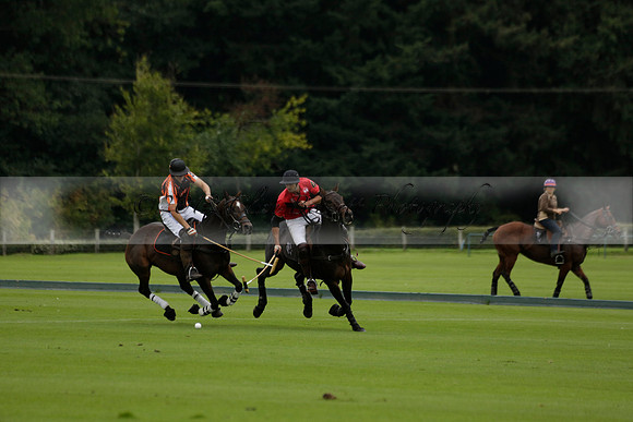 Four Quarters Black (black) v Clashleigh (red) in the Autumn Cup subsidiary final polo match on Ambersham 2 at Cowdray Park Polo Club on Sunday 22 September 2013 www.polopictures.co.uk
