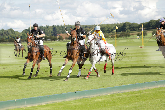 Aryana (black) v Shoreline (yellow) in a Farewell Cup polo match played on Ambersham 5 at Cowdray Park Polo Club on Wednesday 18 September 2013. www.polopictures.co.uk