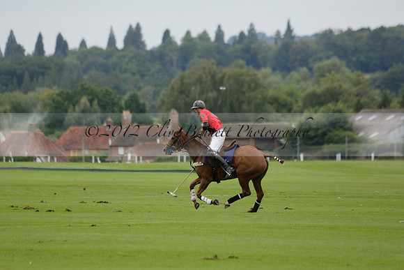 Four Quarters Black (black) v Clashleigh (red) in the Autumn Cup subsidiary final polo match on Ambersham 2 at Cowdray Park Polo Club on Sunday 22 September 2013 www.polopictures.co.uk
