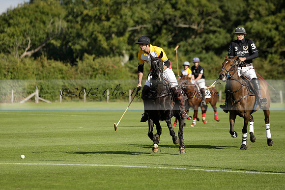 Aryana (black) v Shoreline (yellow) in a Farewell Cup polo match played on Ambersham 5 at Cowdray Park Polo Club on Wednesday 18 September 2013. www.polopictures.co.uk