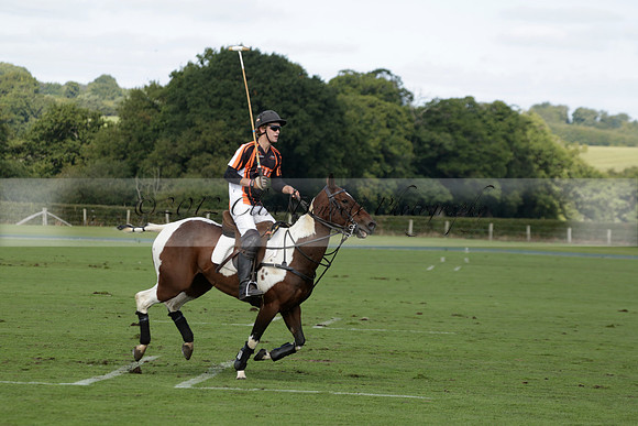 Four Quarters Black (black) v BHC (red) in a Autumn Cup polo match on Ambersham 2 at Cowdray Park Polo Club on Friday 20 September 2013 www.polopictures.co.uk